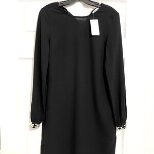 Black H&M DRESS with pearl beaded sleeves.